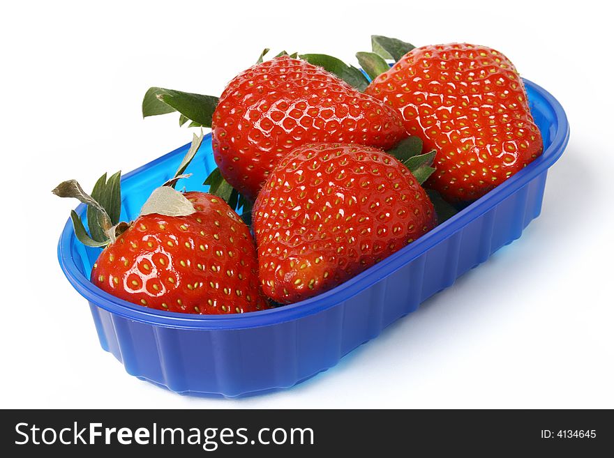 Strawberry in blue bowl isolated on white. Strawberry in blue bowl isolated on white