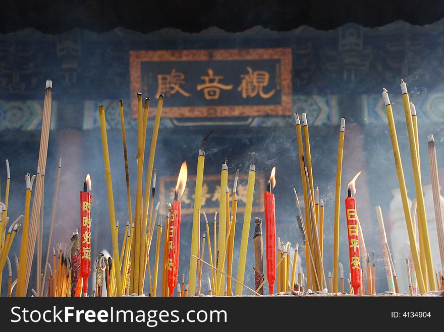 Joss sticks and candles burning at a temple. Joss sticks and candles burning at a temple