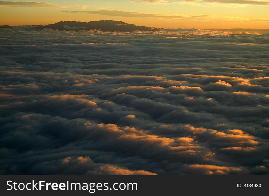 Mountains at sunrise with clouds