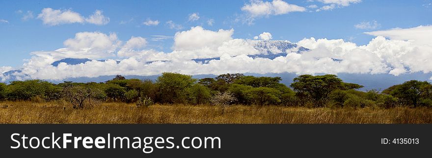 Kilimanjaro Mountains was encircled with white clouds. Kilimanjaro Mountains was encircled with white clouds