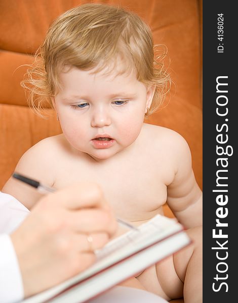 Doctor pediatrician write receipt for little patient. Doctor pediatrician write receipt for little patient