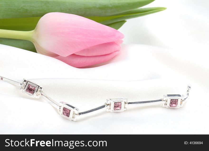 Pink tulip and silver bracelet - still life