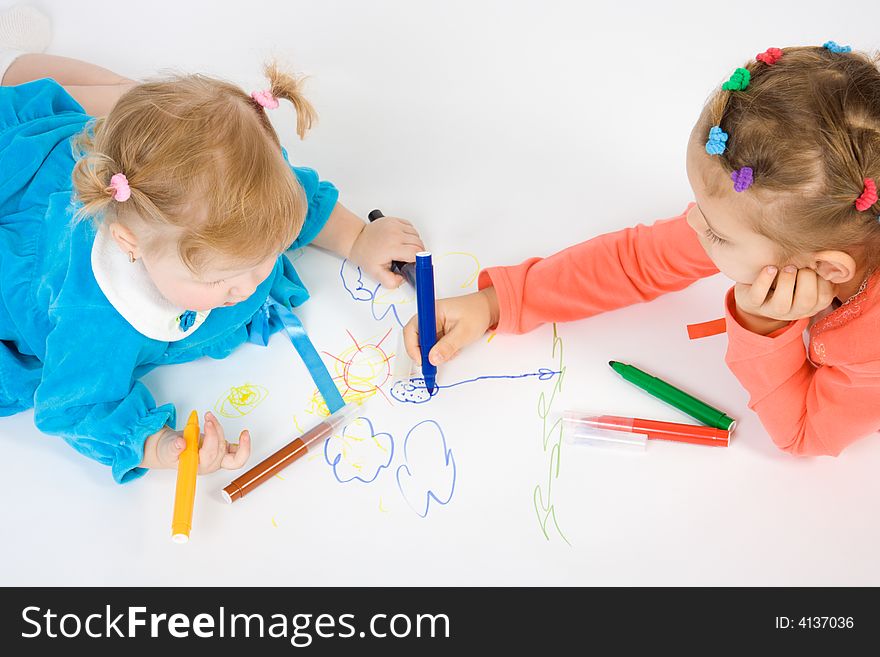 Two little caucasian girl painting . Isolate on white. Two little caucasian girl painting . Isolate on white