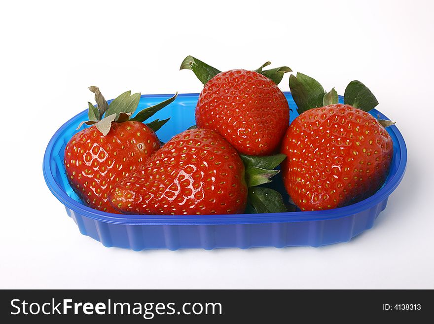 Sweet strawberries in bowl closeup