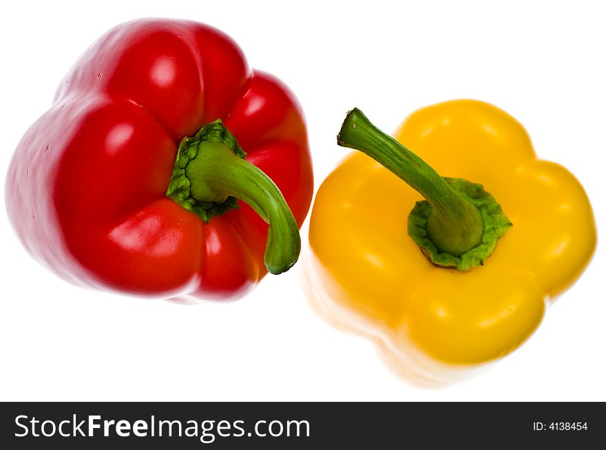 Fresh red & yellow peppers on white background. Fresh red & yellow peppers on white background