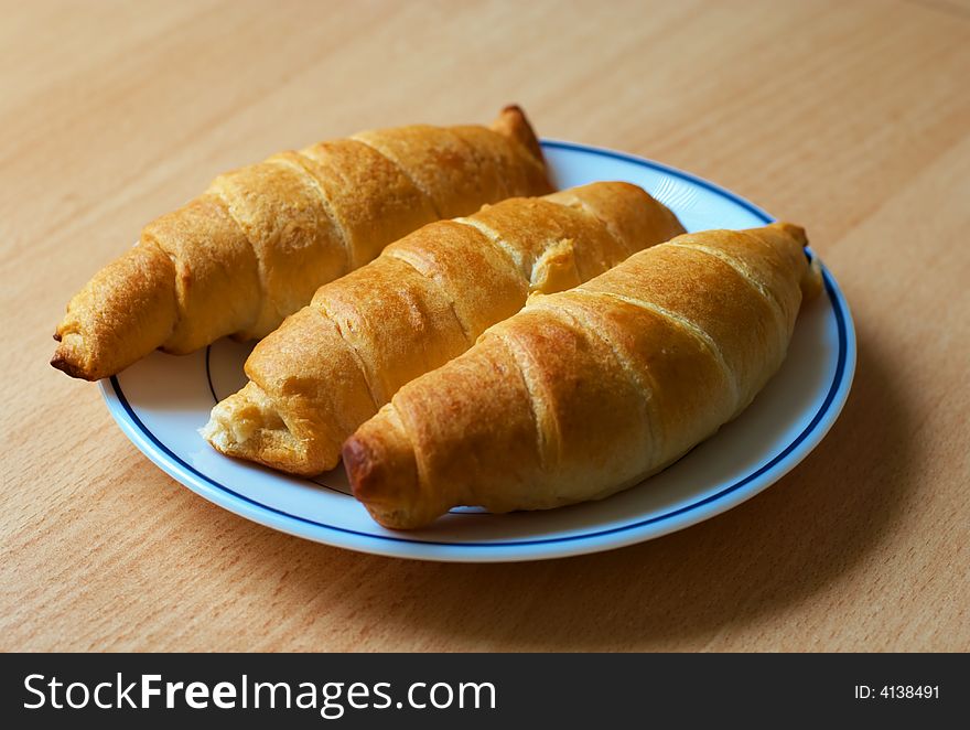 Home baked croissants on plate close-up