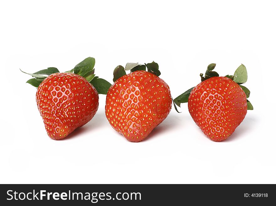 Three strawberries isolated on wnite