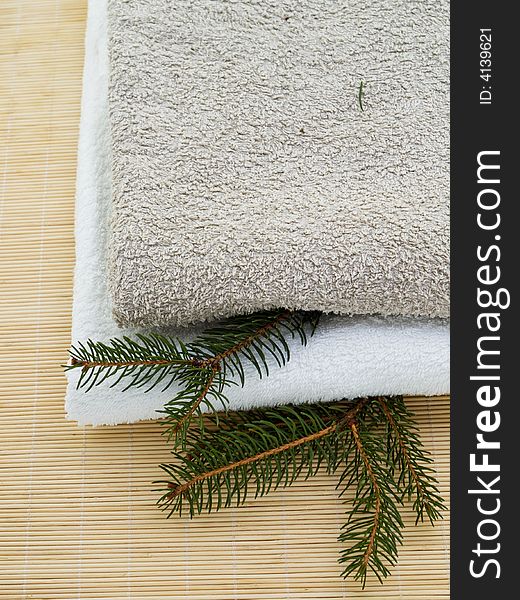 Towels on wooden background with pine branches. Towels on wooden background with pine branches