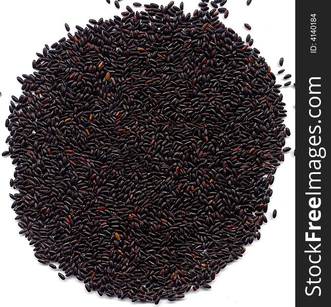 Chinese whole black rice on white background from the top