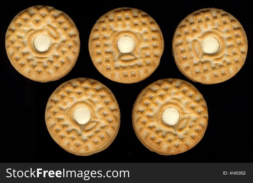 Five cookies on black background mimic olimpic rings