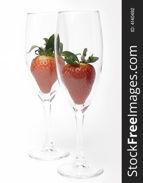 Two strawberries in two glass. Two strawberries in two glass