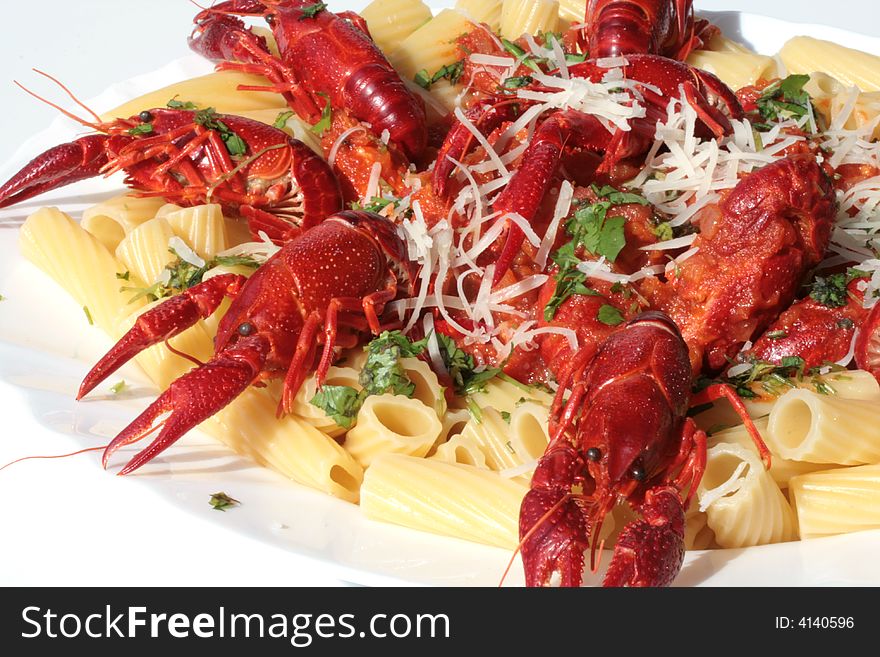 Pasta with delicious crawfish and tomato sauce. Pasta with delicious crawfish and tomato sauce