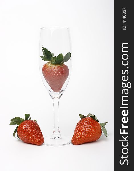 Three strawberry and glass on white. Three strawberry and glass on white