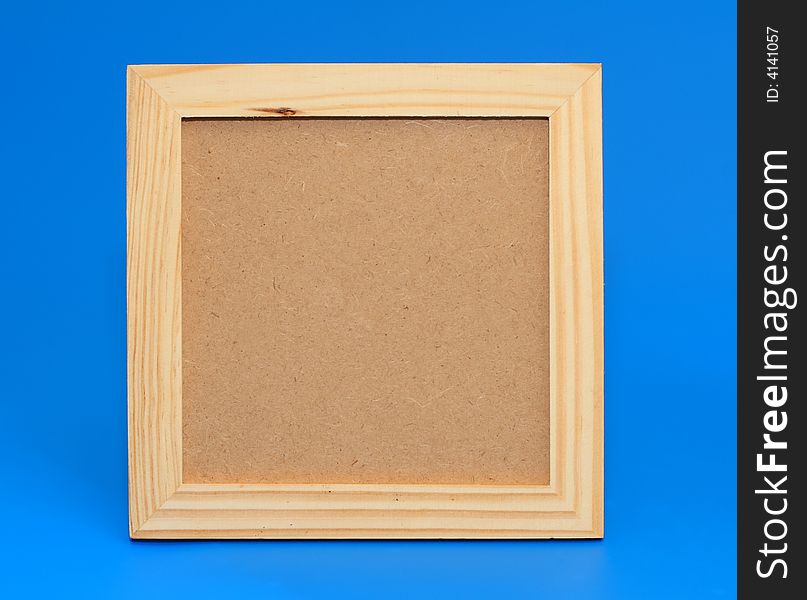 Isolated wooden frame on a blue background