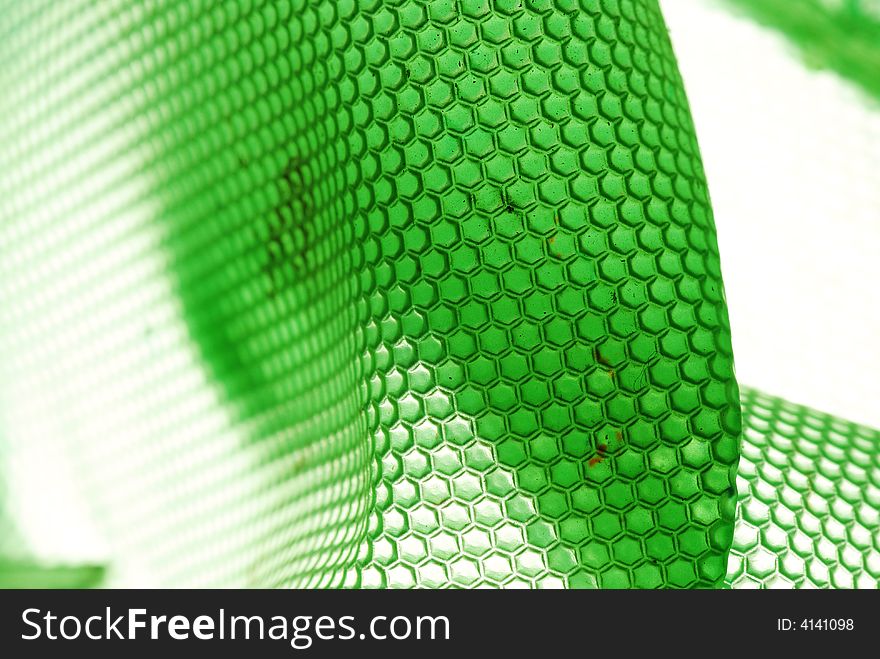 Marco shot of a bee hive shaped background in green. Marco shot of a bee hive shaped background in green