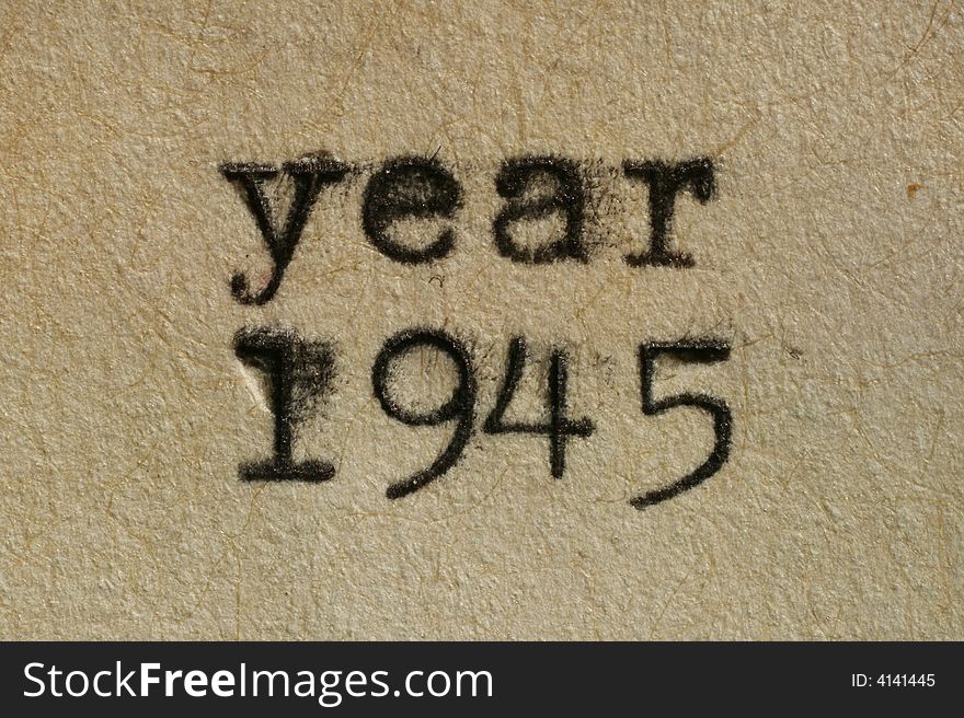 Year 1945 written with an old typewriter on an aged paper.