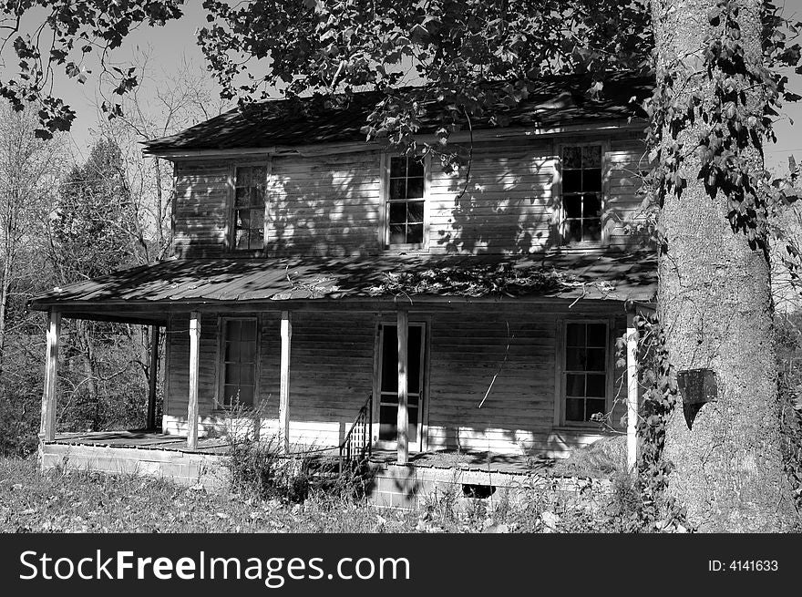 Black and white photo of an old abandoned house. Black and white photo of an old abandoned house