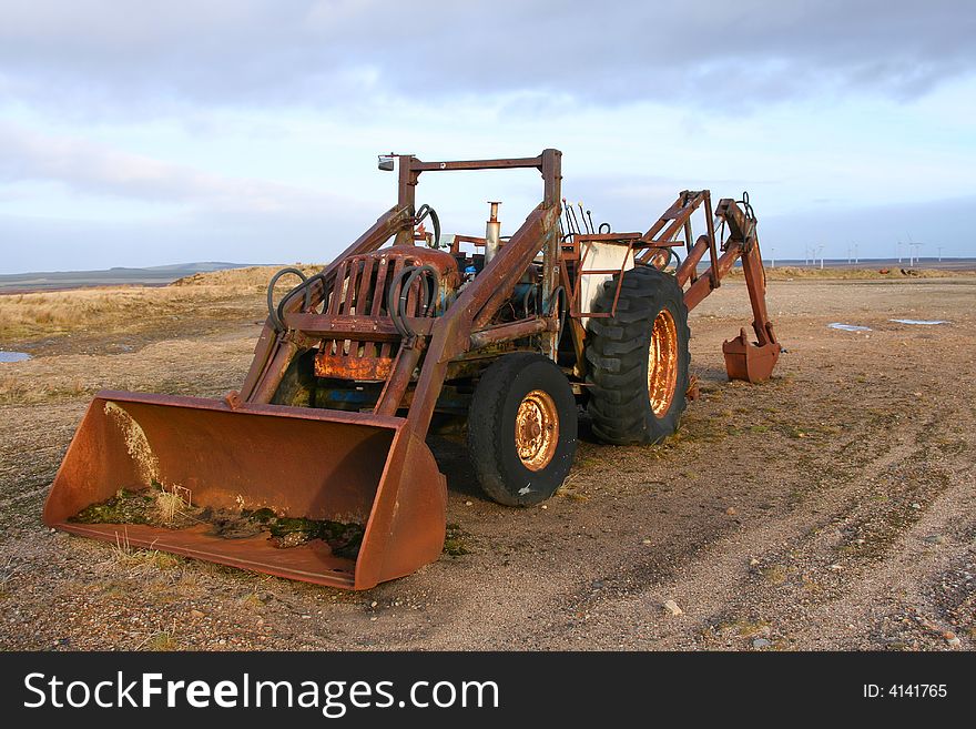 An old abandoned loading vehicle in a disused sand quarry. An old abandoned loading vehicle in a disused sand quarry.