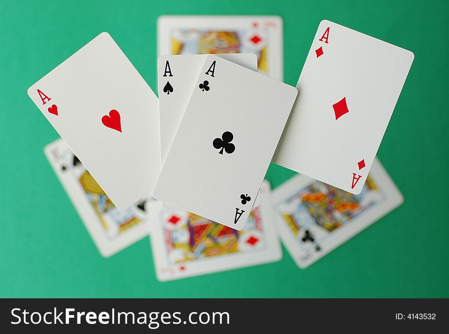 Four Lucky Aces Flying with other cards on the background