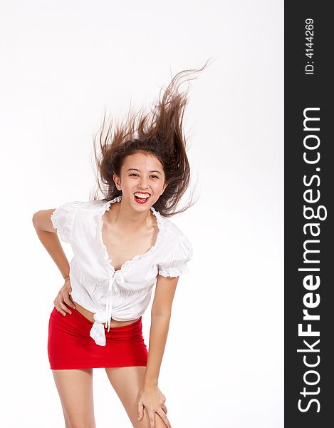 Playful gorgeous girl with hair flowing in the air