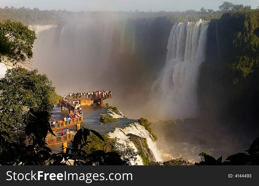 The IguaÃ§Ãº Falls fill the visitors's view with the spray of 72 meter-high falls. The IguaÃ§Ãº Falls fill the visitors's view with the spray of 72 meter-high falls