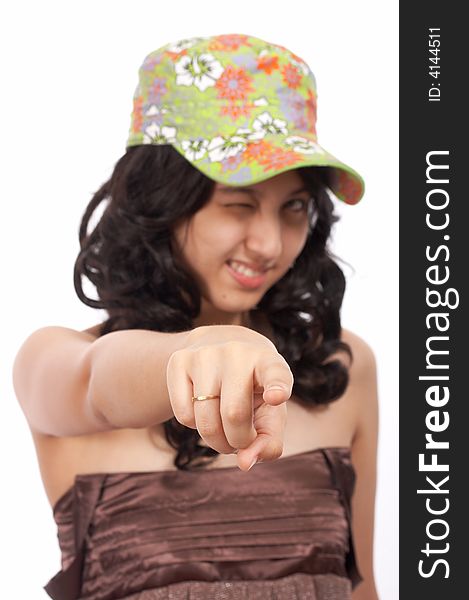 Asian girl pointing - wearing a floral cap