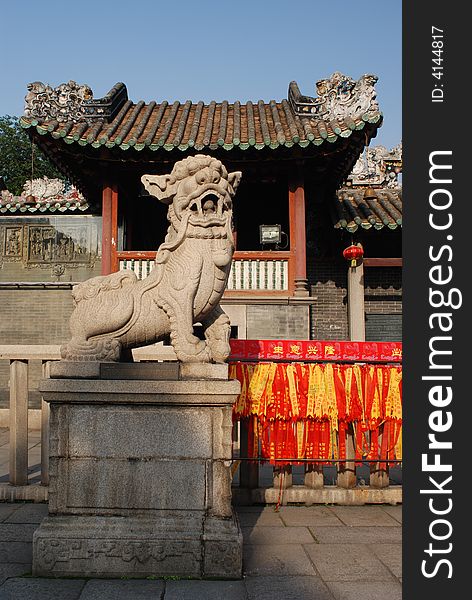 Marble lion sculpture on a terrace ,chinese traditional style lion with a stone ball inside the lion's mouth