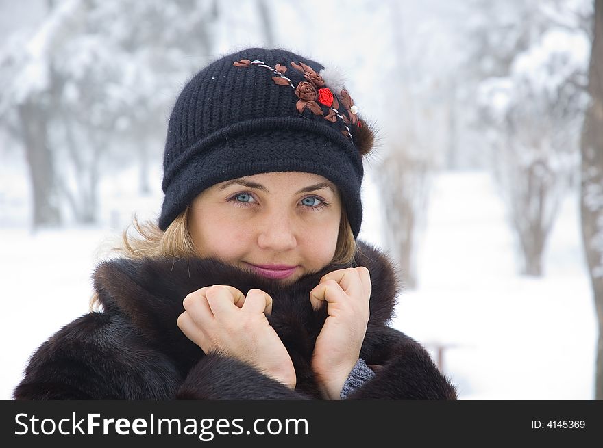 Young beautiful woman at snow winter trees portrait. Young beautiful woman at snow winter trees portrait