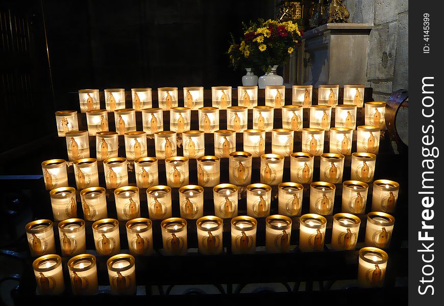 The candle offerings at Notre Dame Church in Paris. The candle offerings at Notre Dame Church in Paris