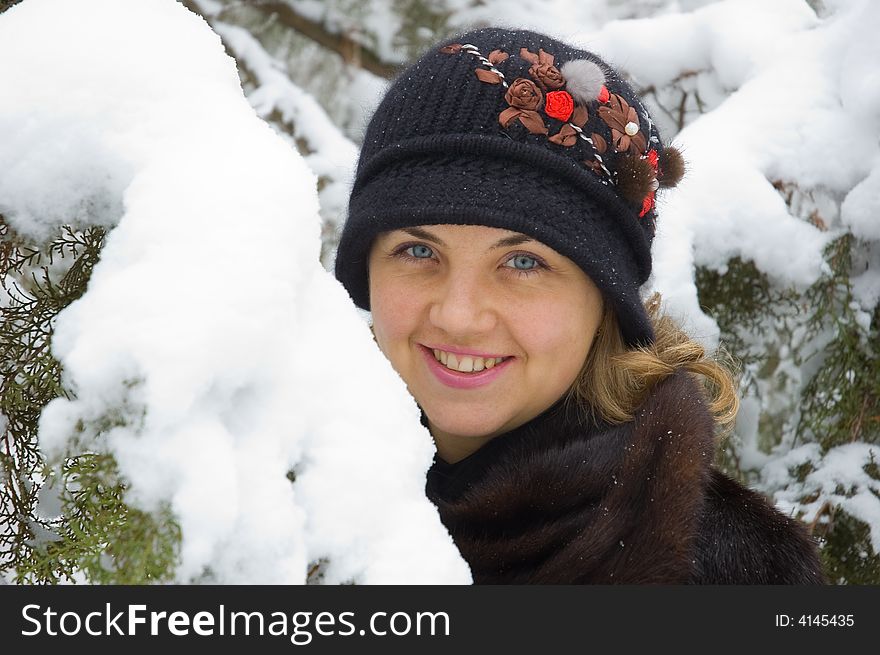 Young beautiful woman at snow winter trees portrait. Young beautiful woman at snow winter trees portrait