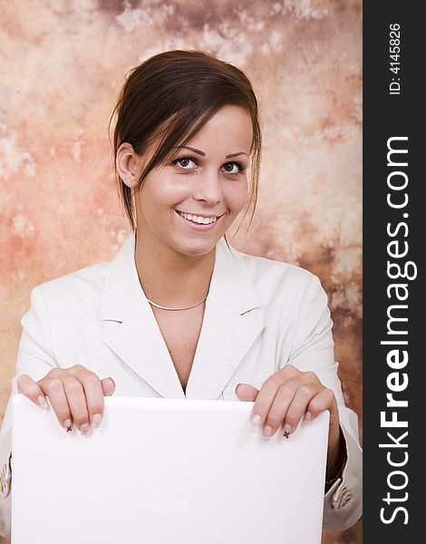 Beautiful young business woman with white laptop computer. Beautiful young business woman with white laptop computer