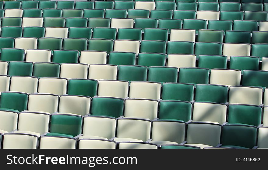 Empty seats at an event. They are two different colors