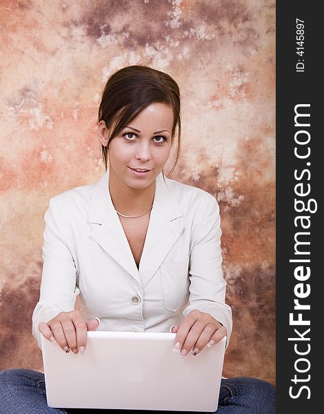 Beautiful young business woman with white laptop computer. Beautiful young business woman with white laptop computer