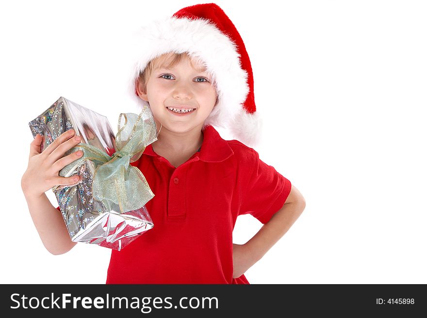 A young boy dressed up as Santa Claus, holding a present. White background. A young boy dressed up as Santa Claus, holding a present. White background.