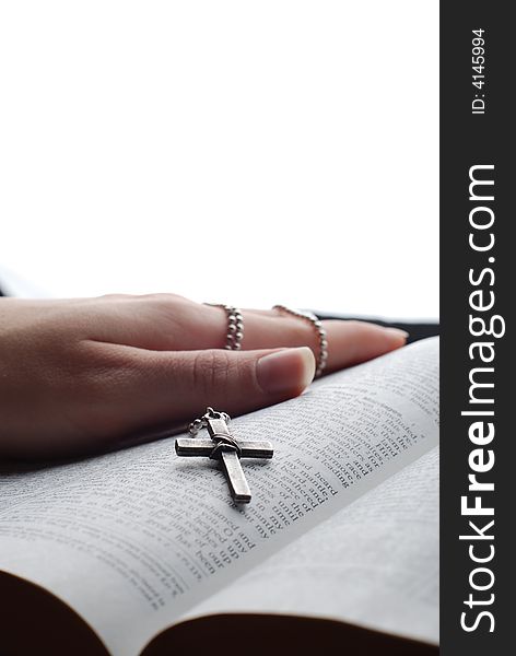 Holy bible open with a cross on a hand. Holy bible open with a cross on a hand