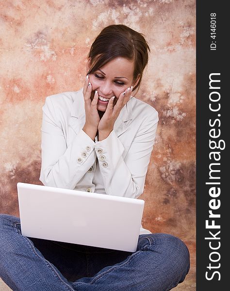 Happy girl with white laptop computer. Happy girl with white laptop computer