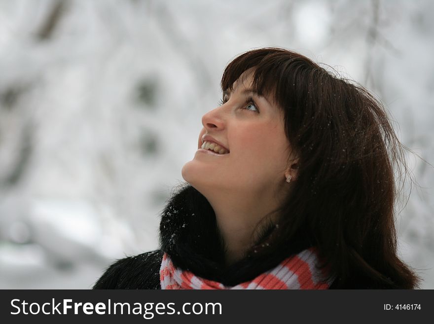 Young Woman Under A Falling Snow