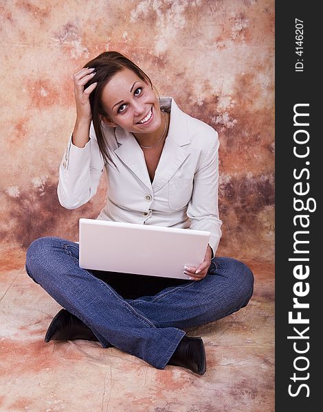 Happy girl with white laptop computer. Happy girl with white laptop computer