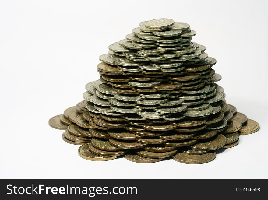 Close-up of pile of coins on the white background (isolated on white)