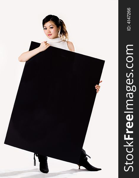 Young woman holding a big black sign. Young woman holding a big black sign