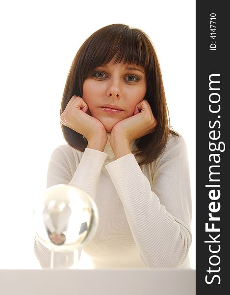 Young woman in white dress near glass magic ball. Young woman in white dress near glass magic ball