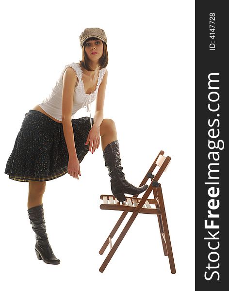 Young woman near the chair dresses in skirt. Young woman near the chair dresses in skirt