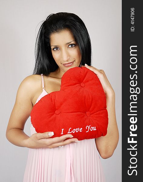 Pretty Indian Girl holding Valentine Heart.