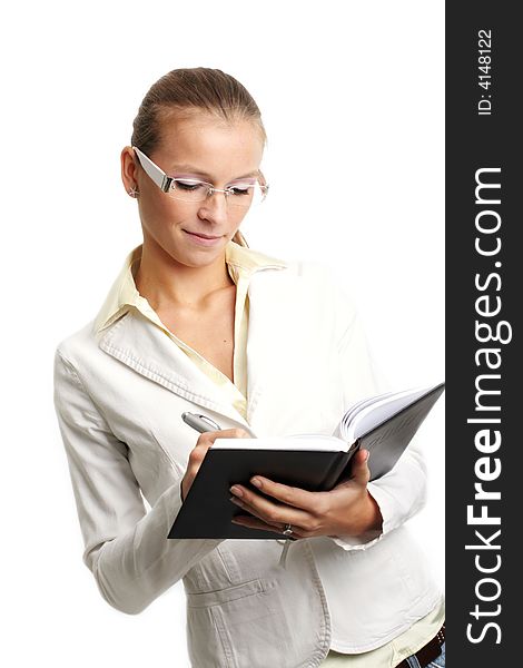 Business portrait of a young and successful woman writing at a folder. Business portrait of a young and successful woman writing at a folder