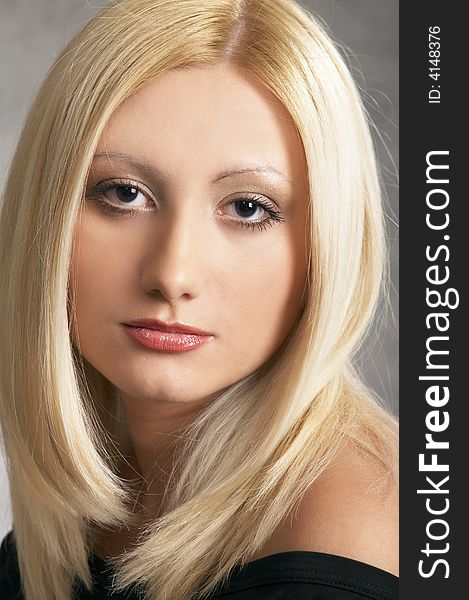 Close up of a Glamor girl posing on a grey background