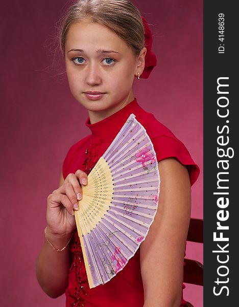 Dancing with fans on a red background