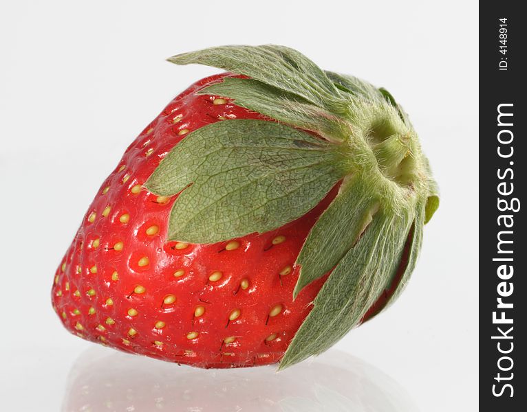 This single strawberry ready to be trimmed and eaten