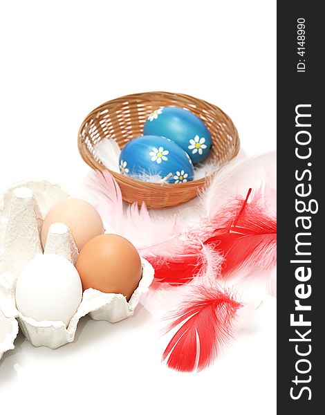 Natural eggs with white and red feathers on white background. Natural eggs with white and red feathers on white background