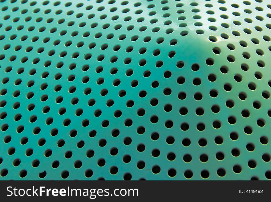 Green pattern of holes in a conical form. Green pattern of holes in a conical form