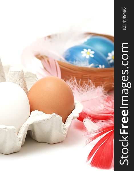 Natural eggs with white and red feathers on white background. Natural eggs with white and red feathers on white background